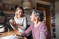 Washing up young+older woman